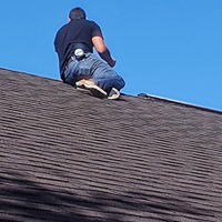 company adjuster inspecting roof claim